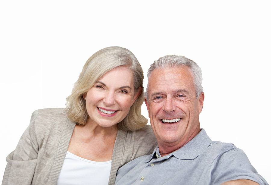 smiling older couple with beautiful teeth