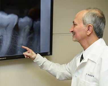 Doctor Makadia reviewing x-rays during second opinion visit