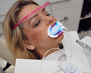 Patient recieving GLO in-office teeth whitening