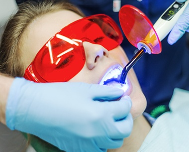 Patient receiving cosmetic dental bonding treatment