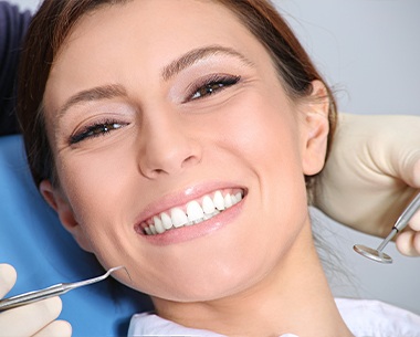 Woman smiling after laser assisted ceramic debonding