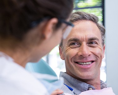Man smiling during comprehensive family dentistry visit