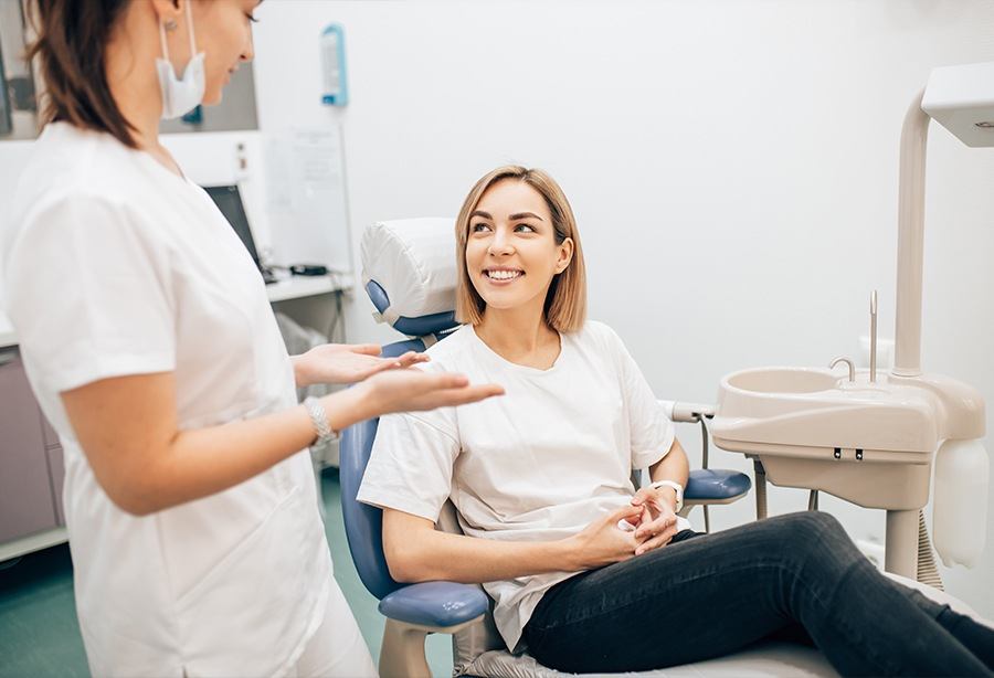 Woman discussing sedation dentistry with the dentist