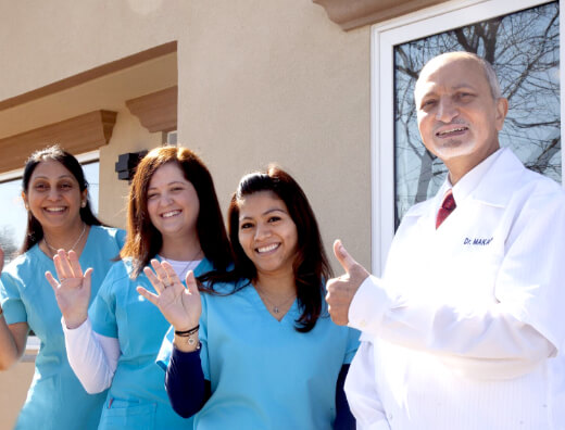 Bohemia dentist and dental team members outside of dental office