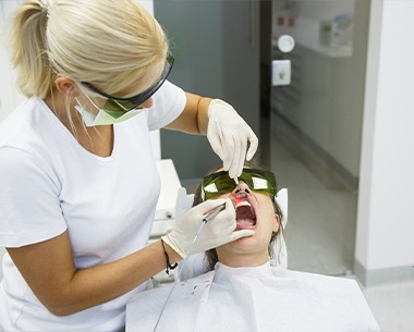 Patient receiving conservative laser dentistry treatment