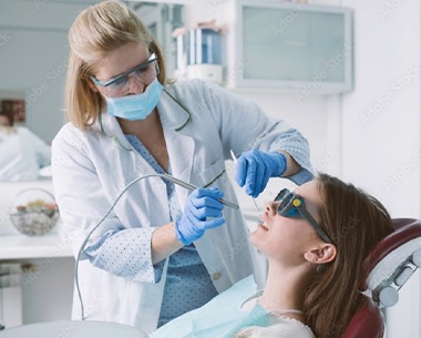 Patient receiving frenectomy treatment