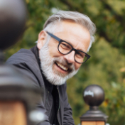 Older man outdoors smiling