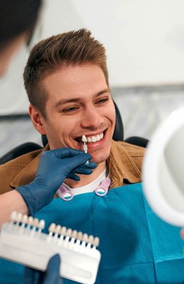 Patient smiling with new veneers