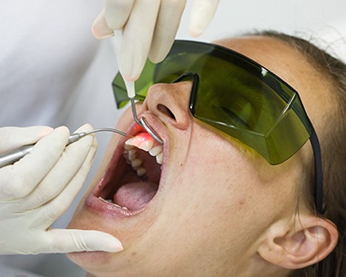 Patient receiving laser gum surgery