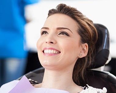 Comfortable patient smiling during periodontal treatment visit