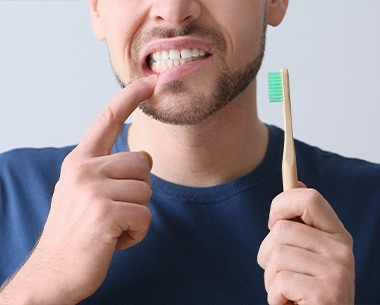 Man with inflamed soft tissue due to periodontal disease