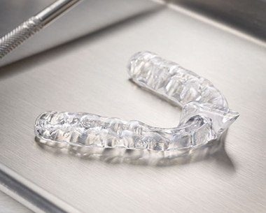 Clear nightguard for bruxism on metal tray