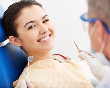Woman smiling during preventive dentistry visit