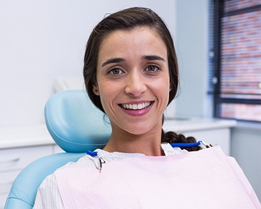 Woman sharing healthy smile after restorative dentistry