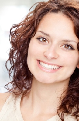 Woman with flawless smile after cosmetic dentistry