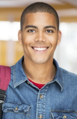Young man with straight smile after orthodontic treatment