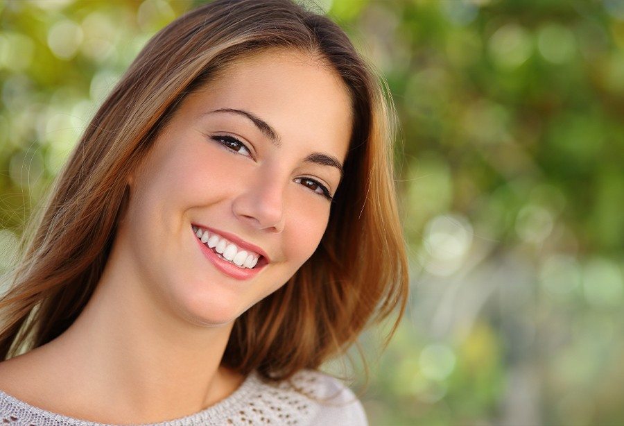 Woman sharing flawless smile after cosmetic dentistry