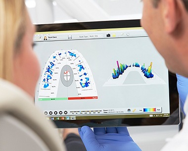 Dentist and patient looking at Tekscan occlusal analysis