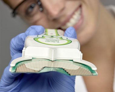 Dental team member holding Tekscan device