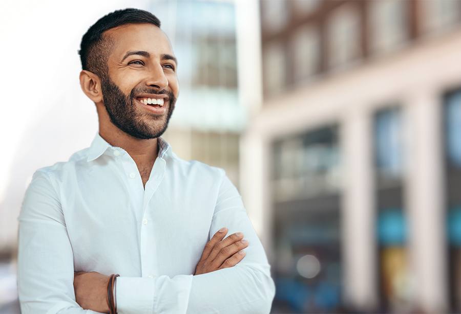 Man with healthy smile after tooth colored filling restoration