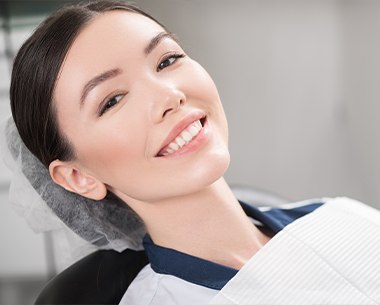 Woman with bright smile after teeth whitening