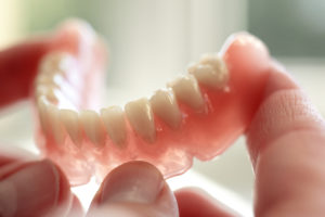 Benefit from same-day repairs for dentures in Sayville.