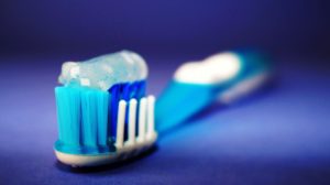 Toothbrush and toothbrush on counter at dentist.