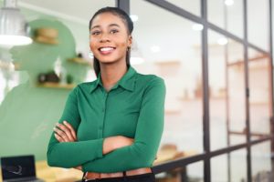 Confident businesswoman, smiling after cosmetic dental treatments