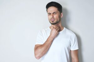 Man with sore throat, concerned about oral cancer