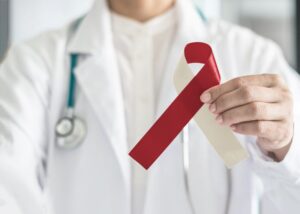 Doctor holding oral cancer ribbon